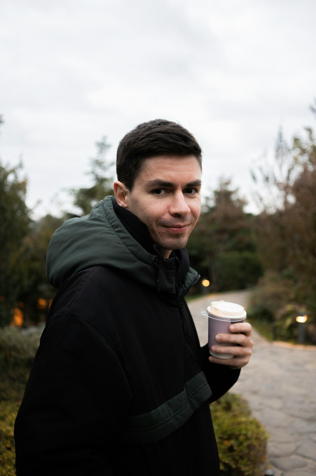 Portrait of a smiling man in a dark jacket